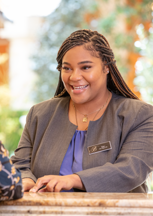 a person smiling at a person at a reception