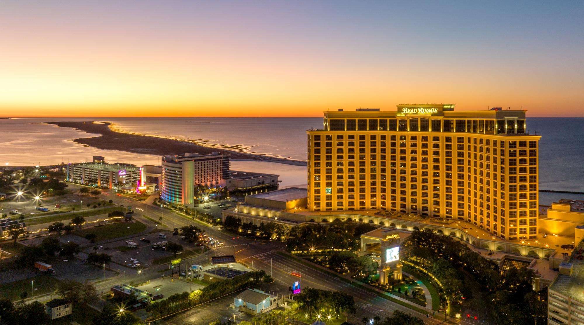 a large hotel next to a beach