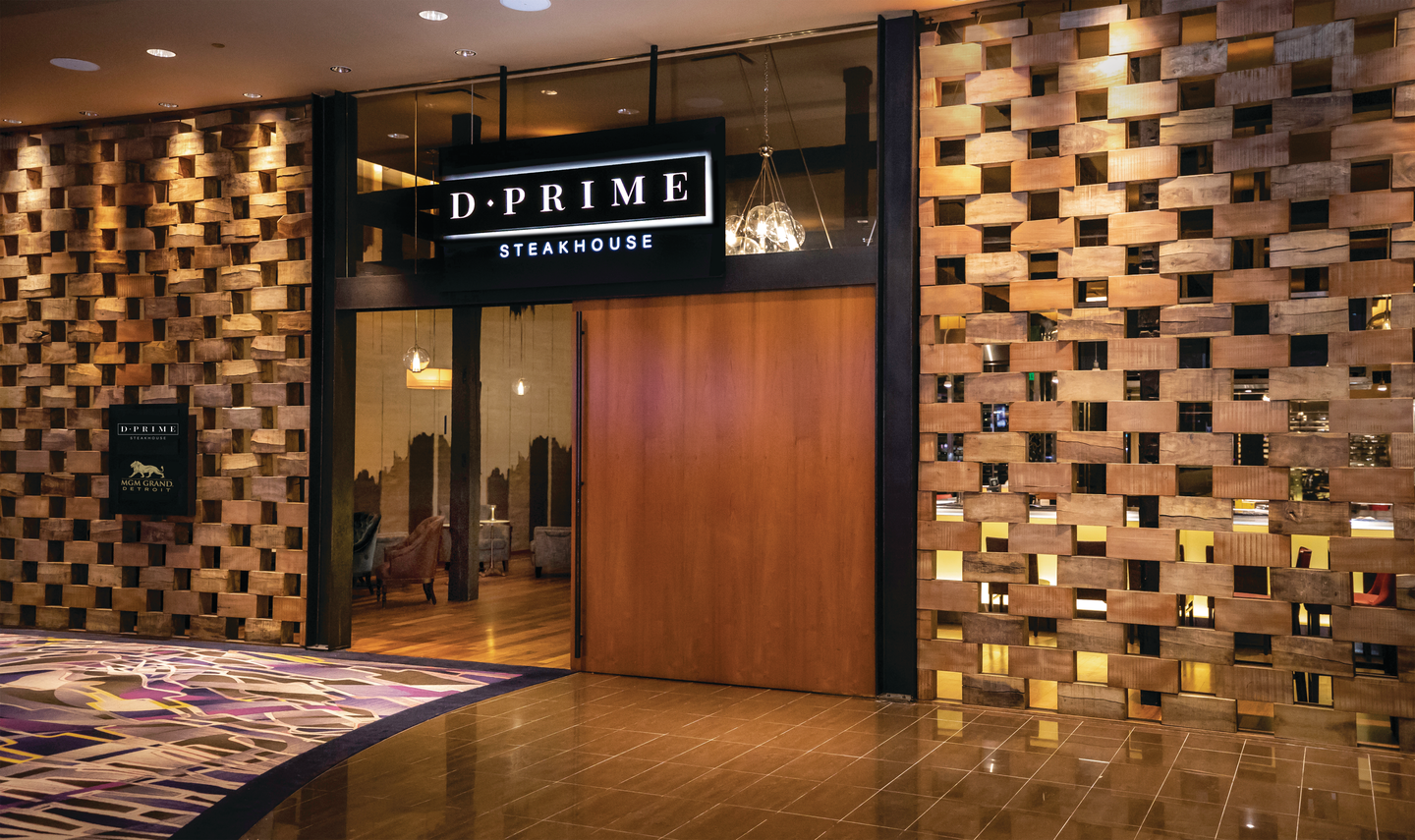 a restaurant entrance with a sign