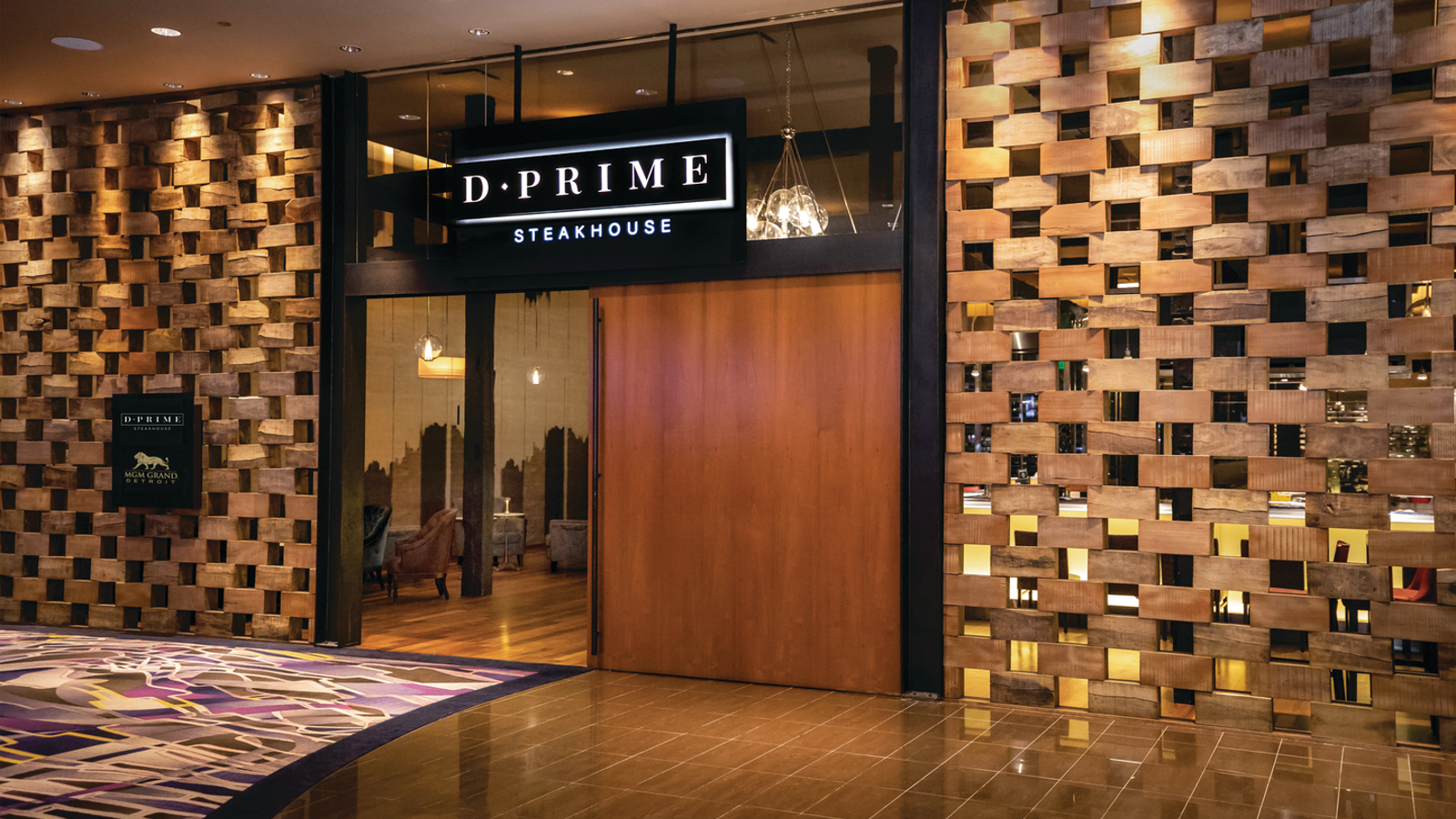 a restaurant entrance with a sign