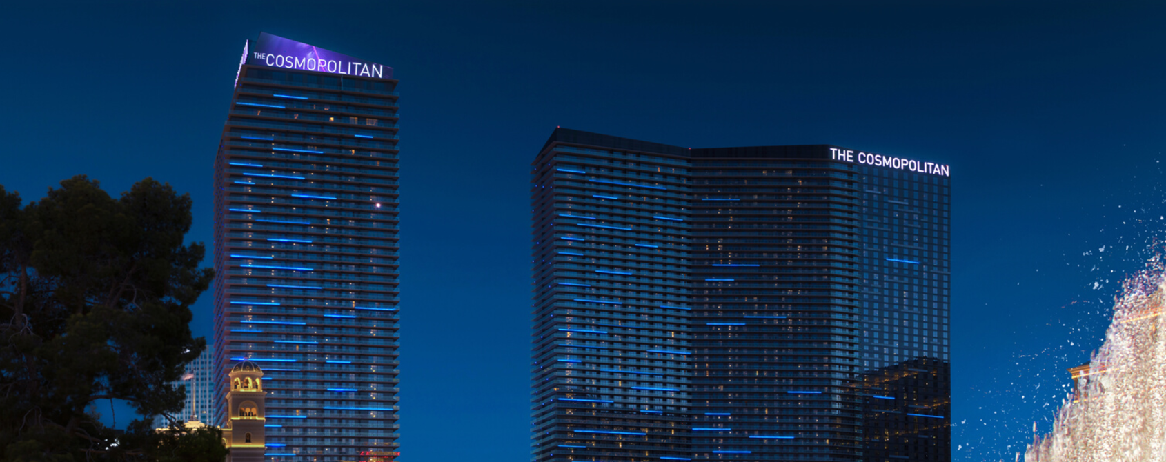 a group of tall buildings with blue lights