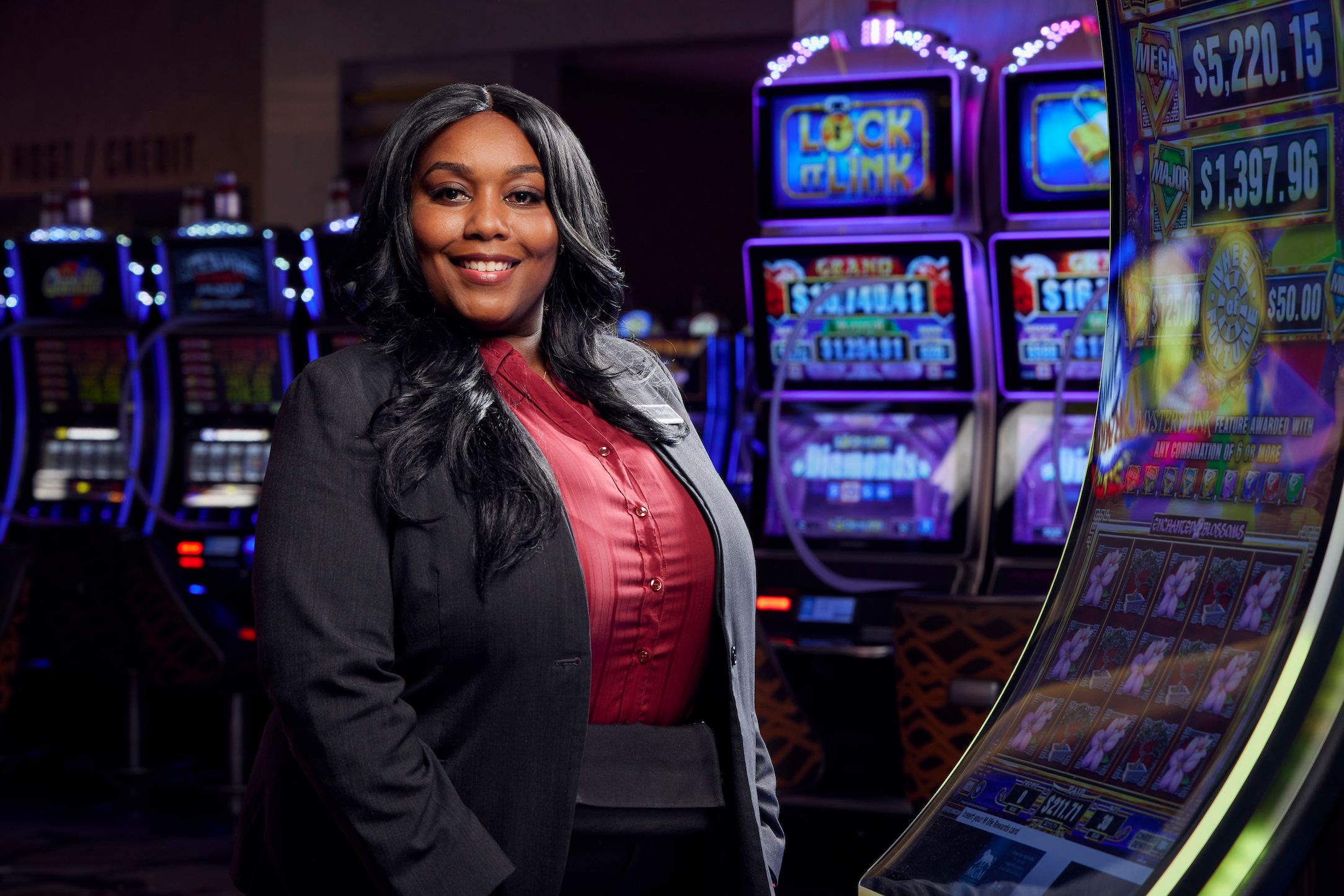 a person standing in front of slot machines