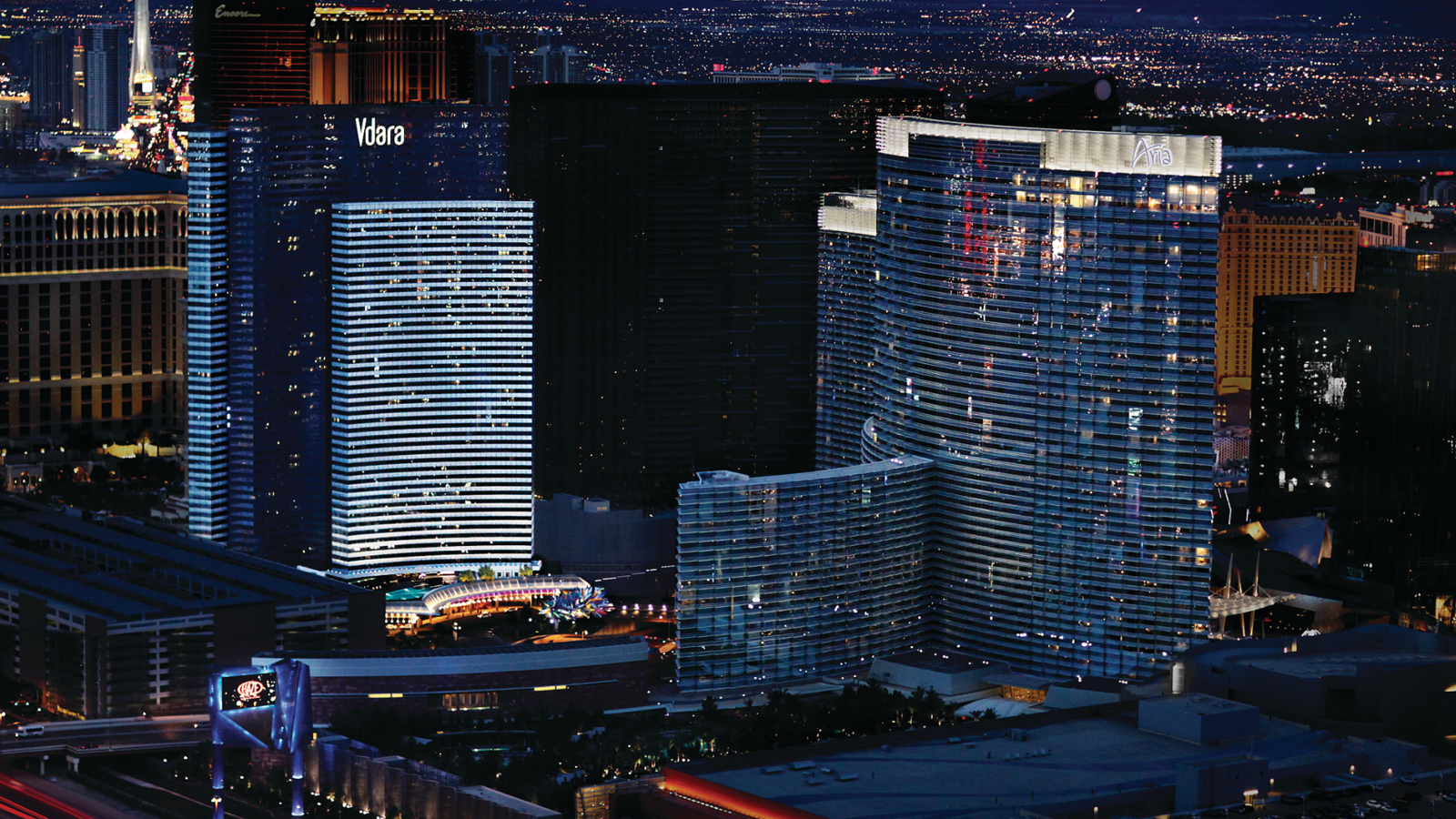 a group of tall buildings at night