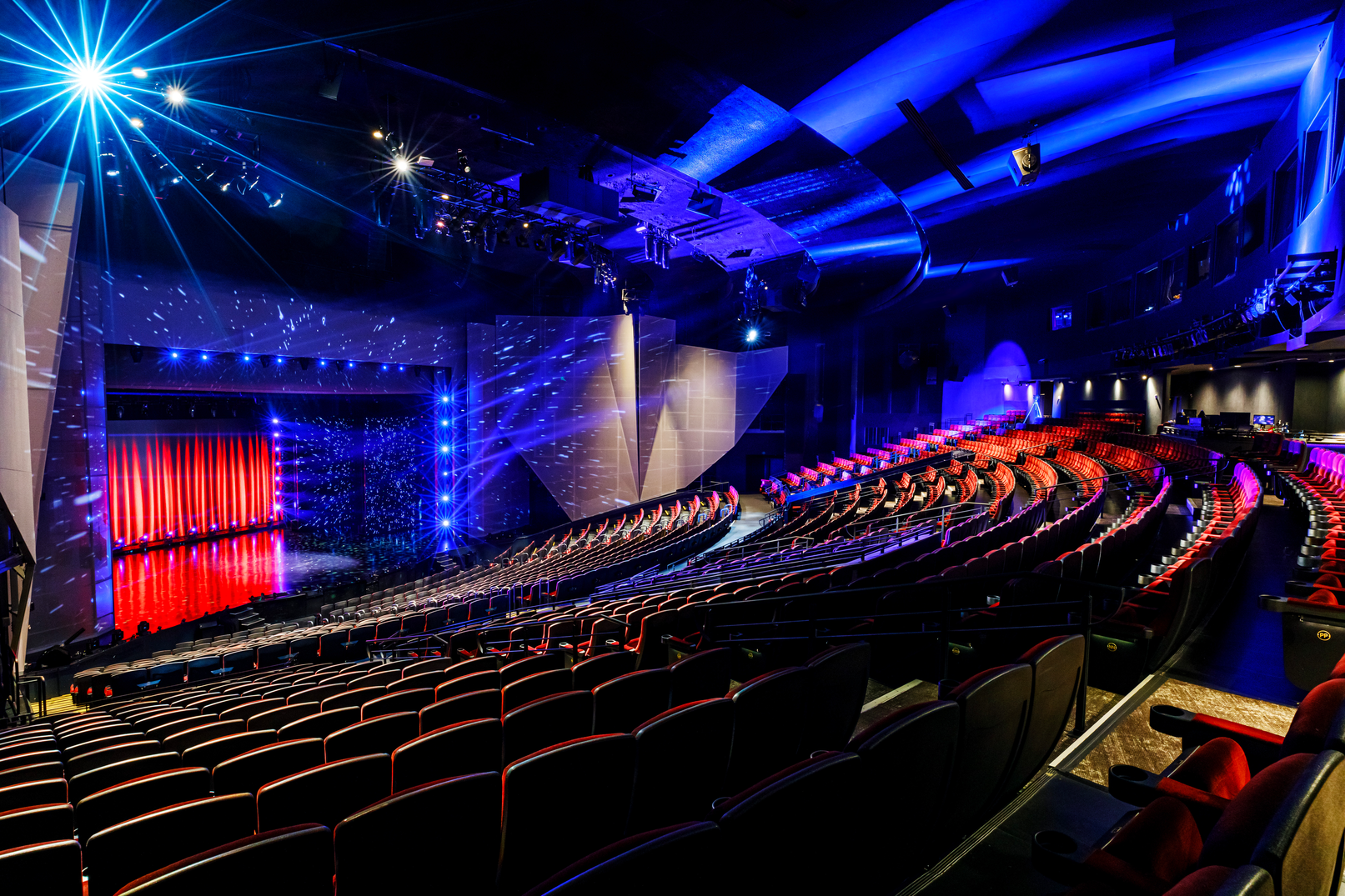 a theater with red and blue lights