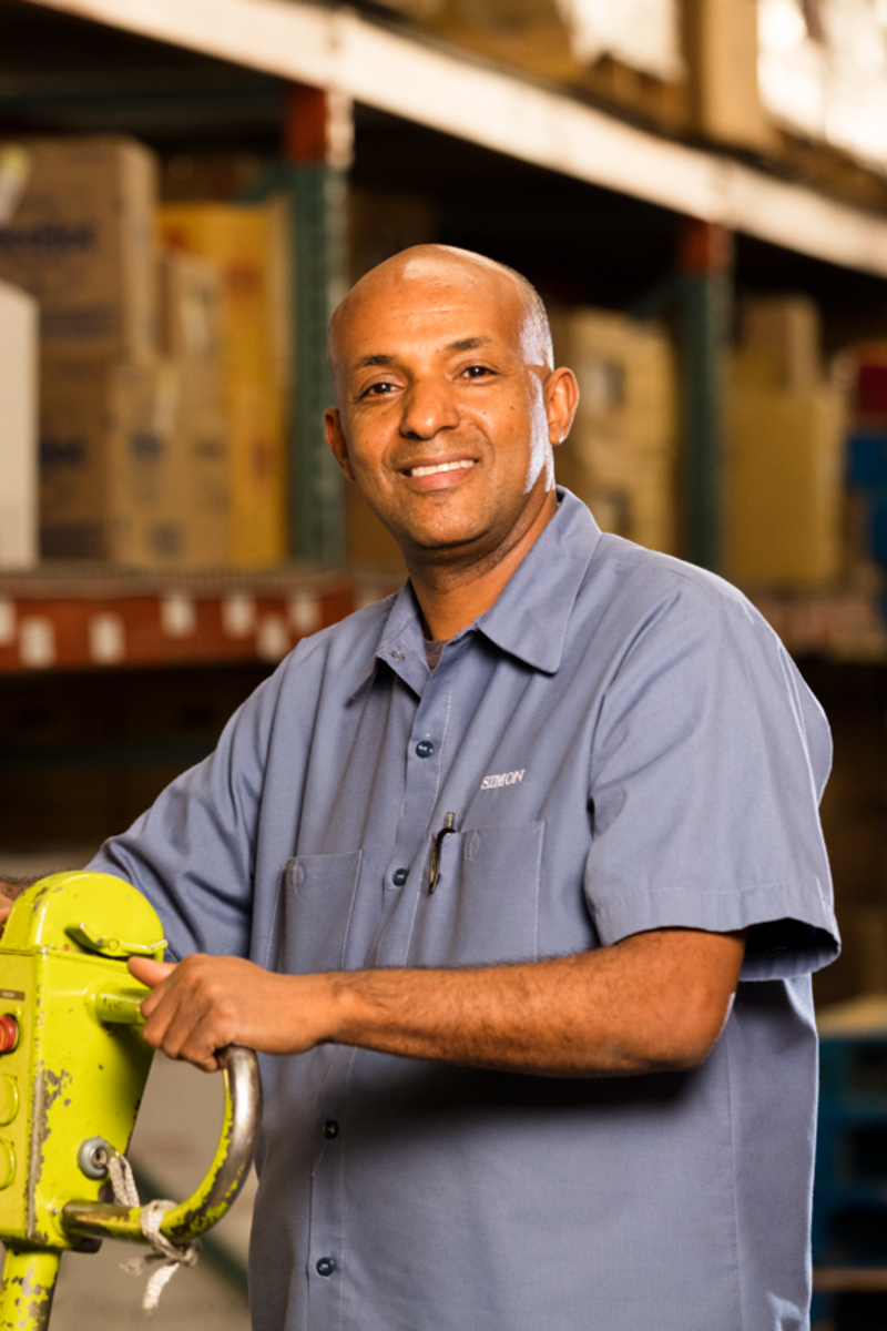 a person holding a yellow machine