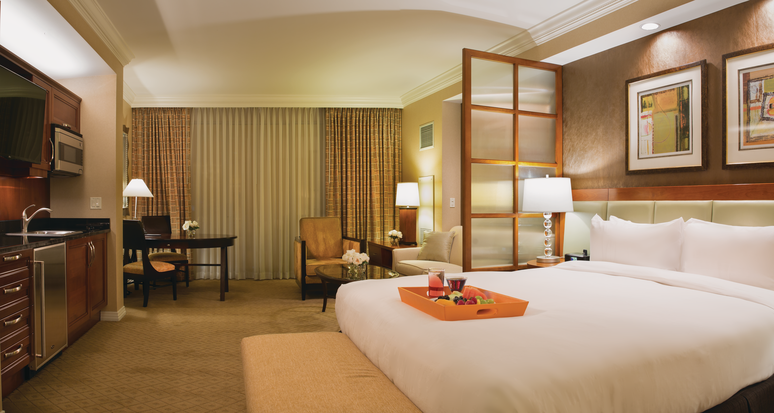 a hotel room with a bed and a table