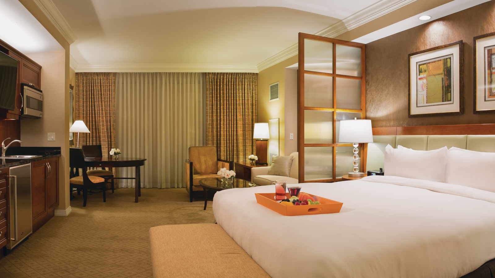 a hotel room with a bed and a table