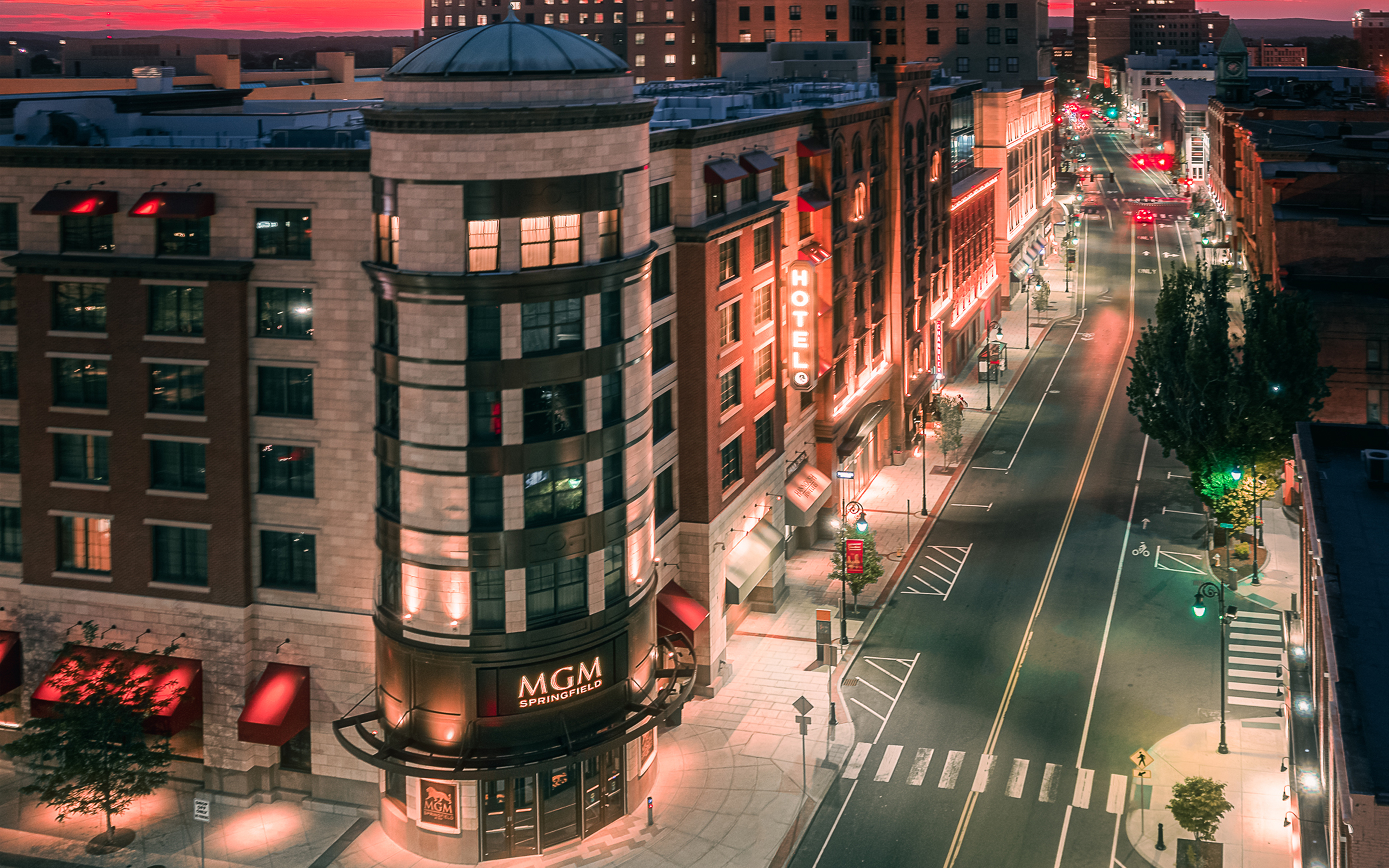 a city street with buildings and lights