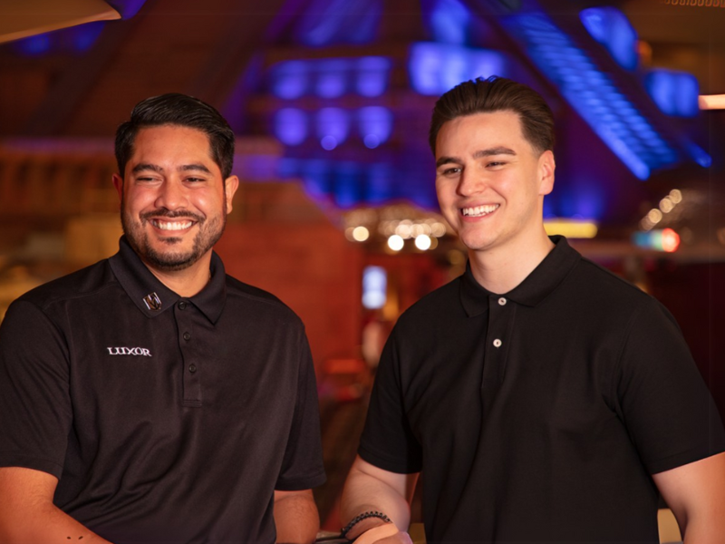 two men smiling at the camera