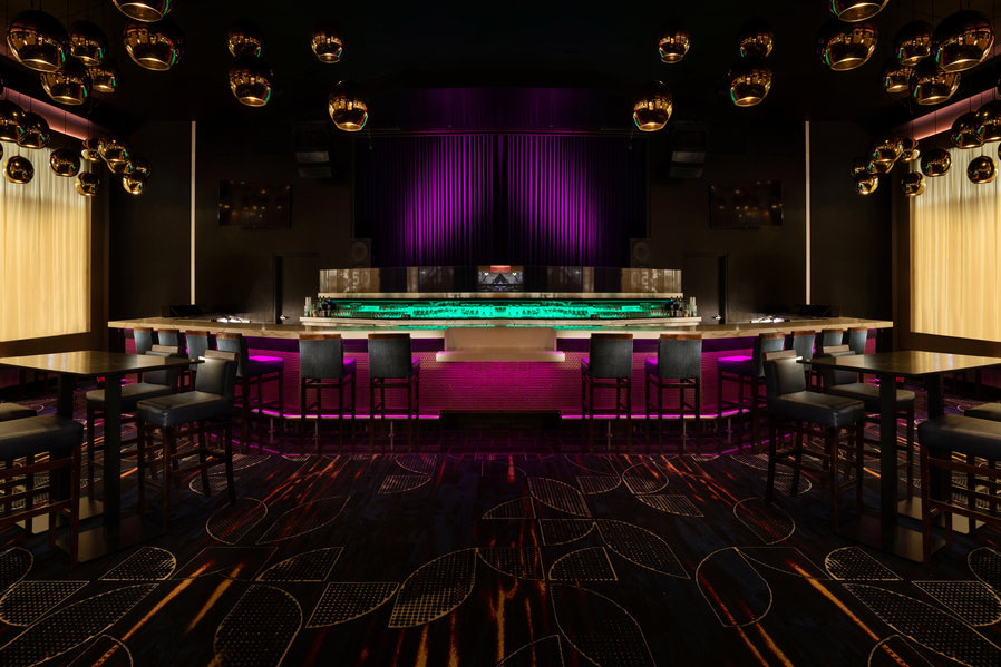 a room with a bar and purple carpet