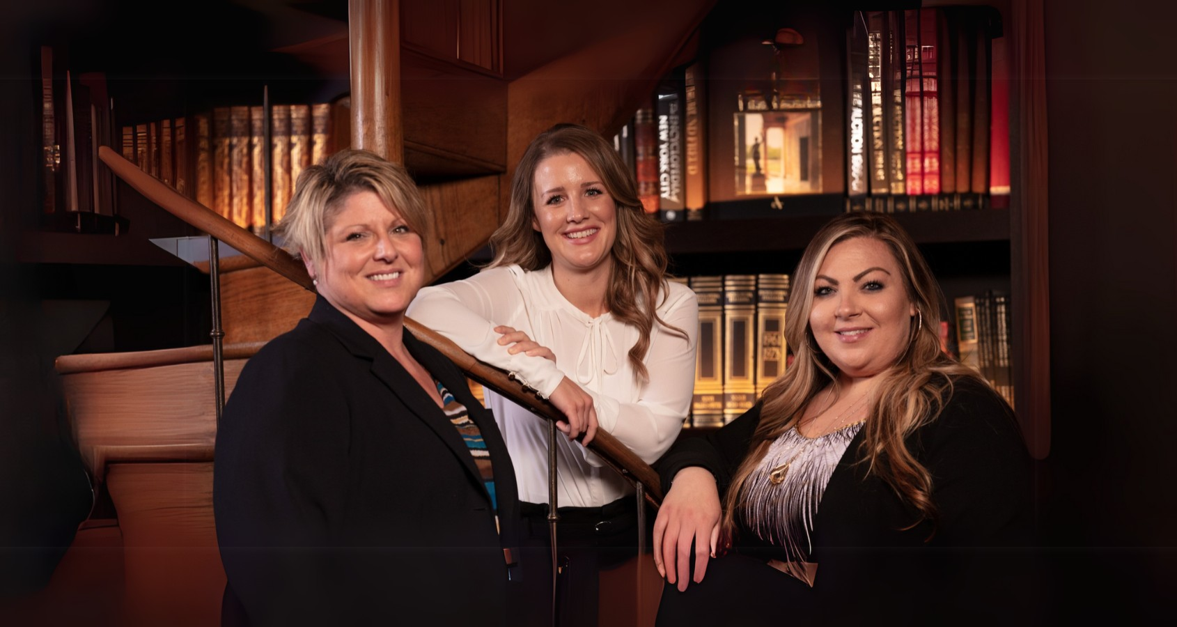 a group of women posing for a photo
