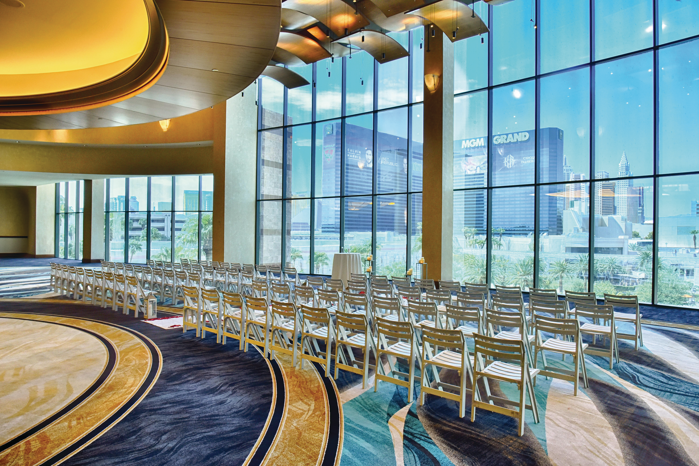 a room with persony chairs and a large window
