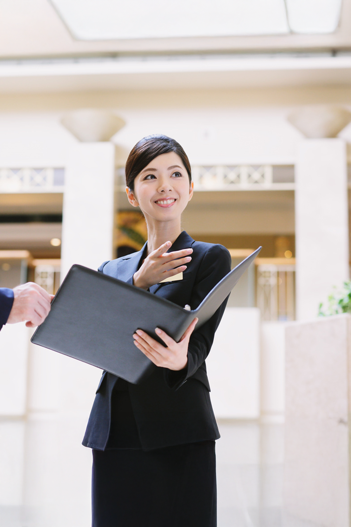 a person holding a folder