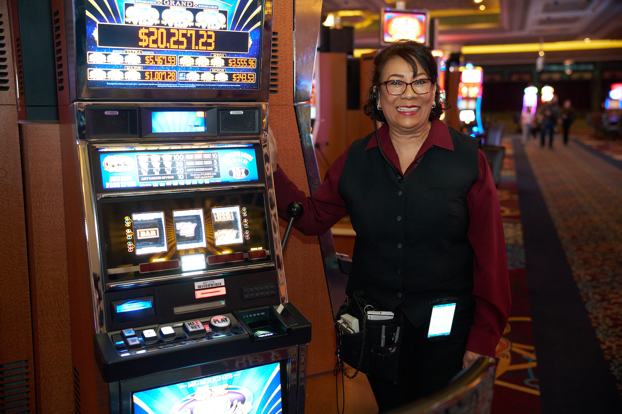 a person standing next to a slot machine