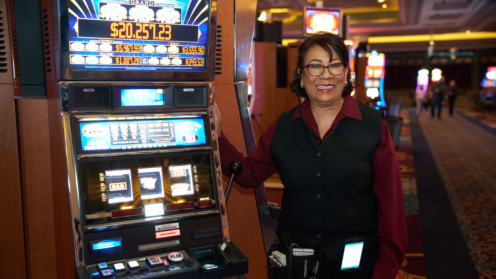 a person standing next to a slot machine