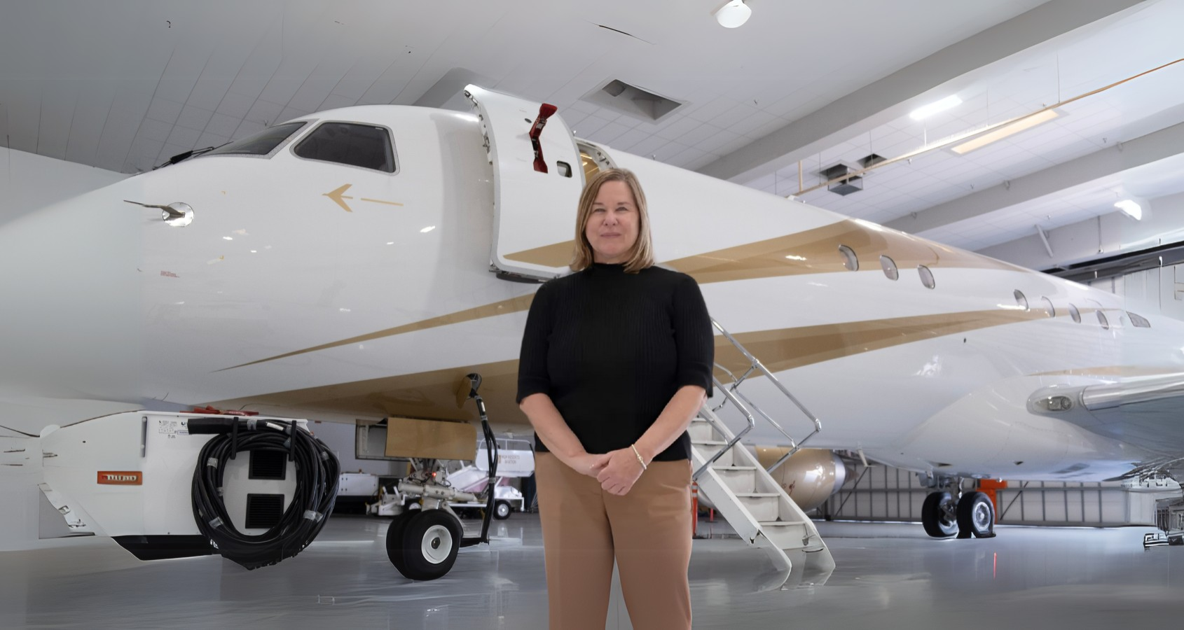 a person standing in front of a plane
