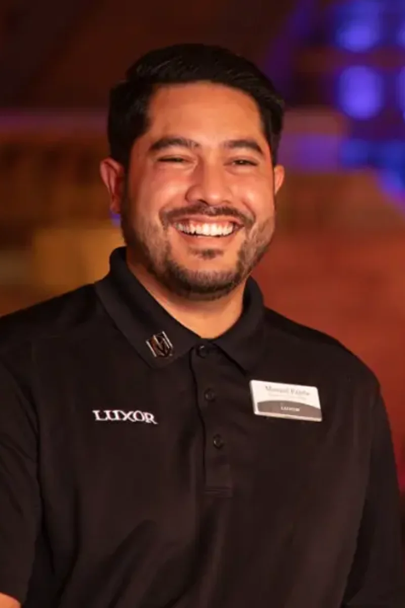 two men smiling at the camera