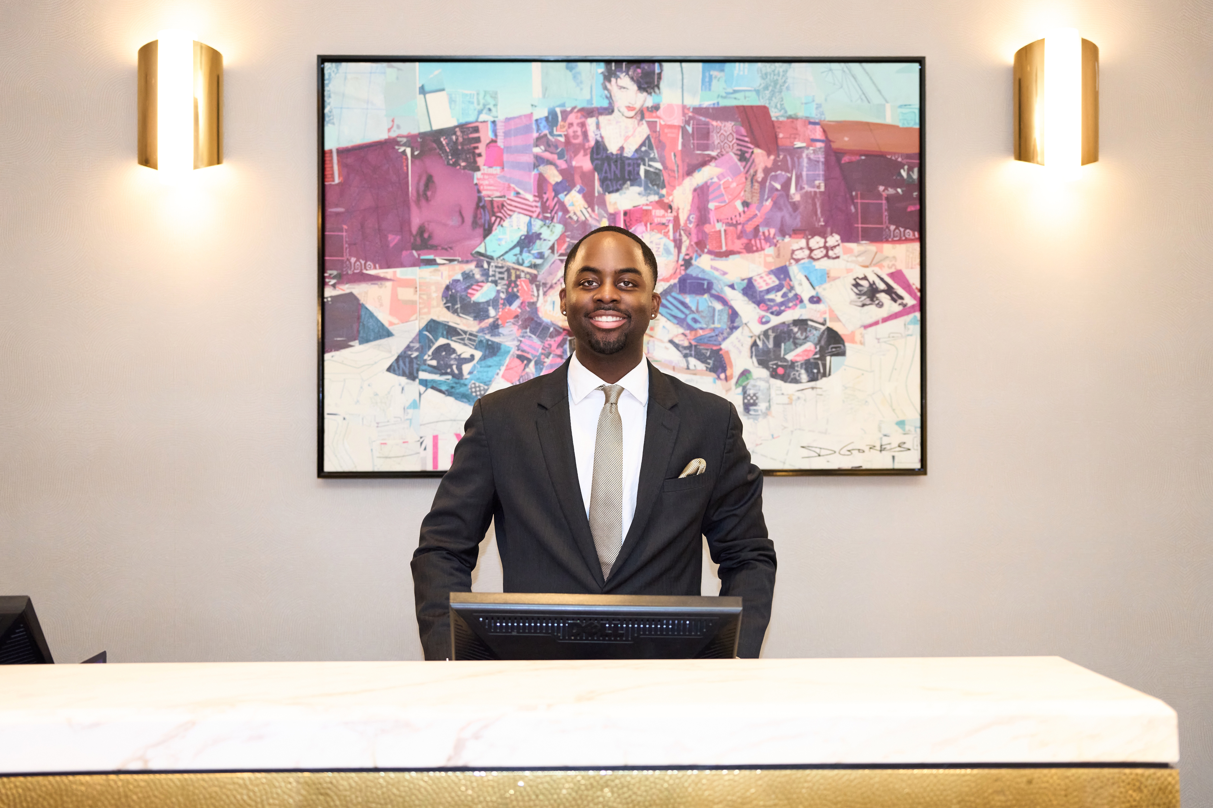 a person standing behind a desk