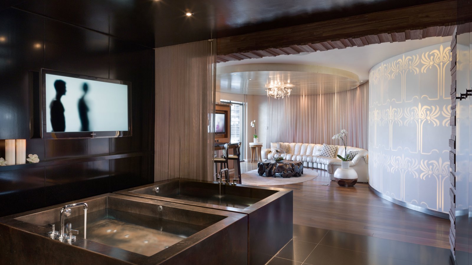 a room with a large tub and a tv