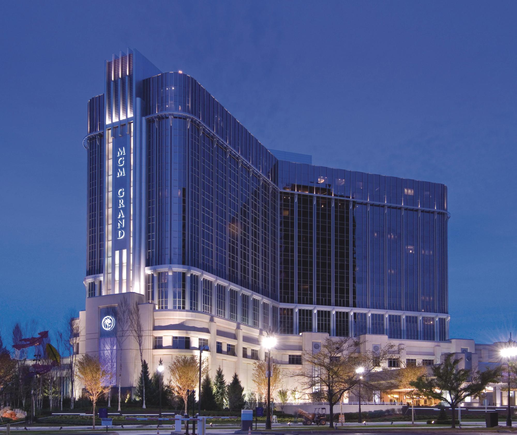 a large building with persony windows with MGM Grand Detroit in the background
