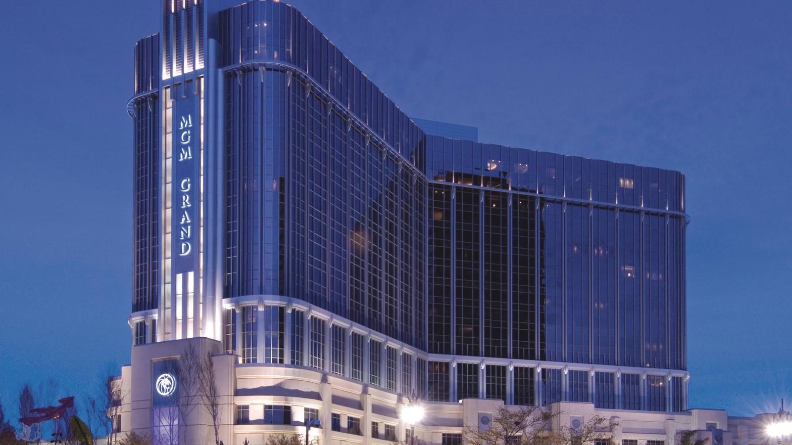 a large building with persony windows with MGM Grand Detroit in the background