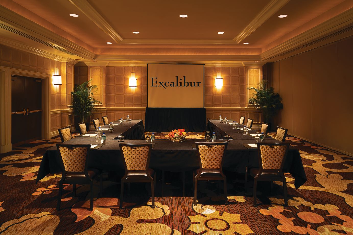 a room with a large table and chairs