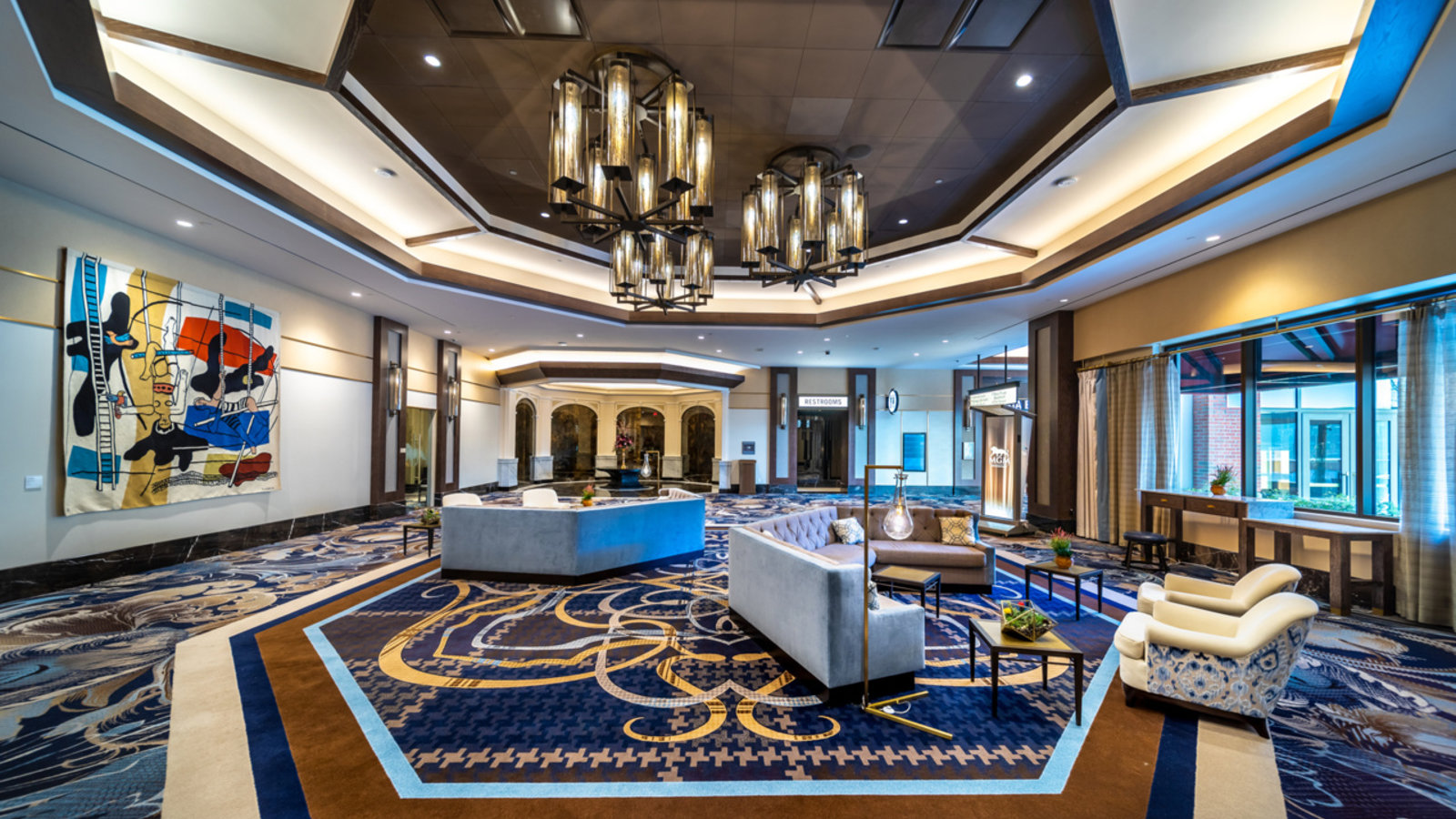a large room with a large reception desk and chairs