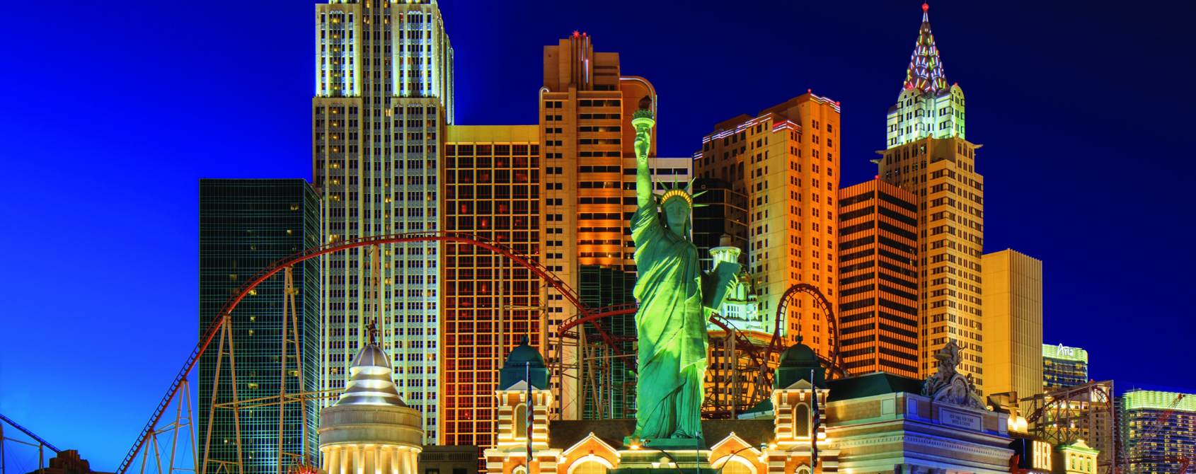 a statue of liberty in front of a city