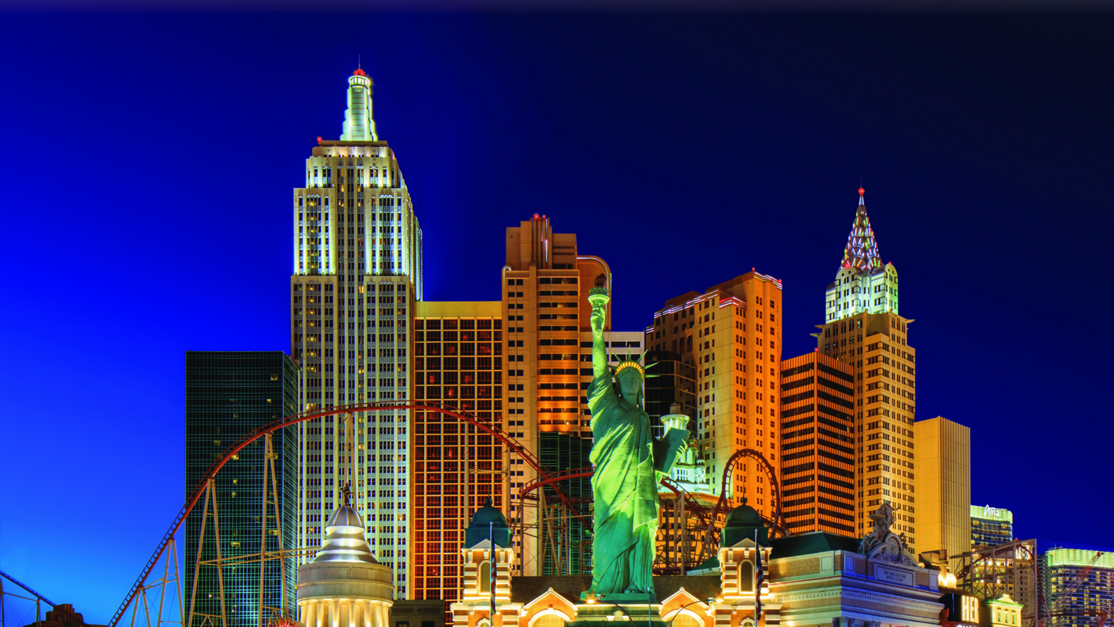 a statue of liberty in front of a city