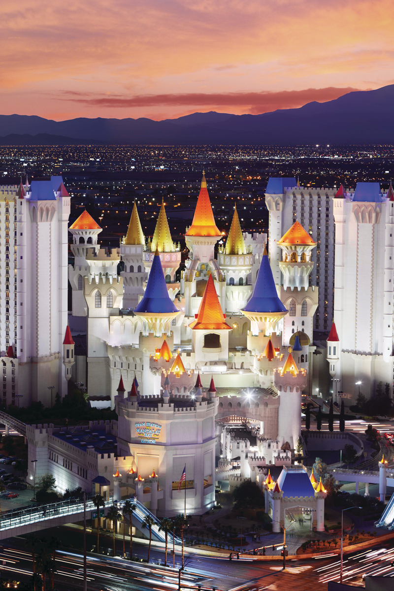 a large white building with colorful towers