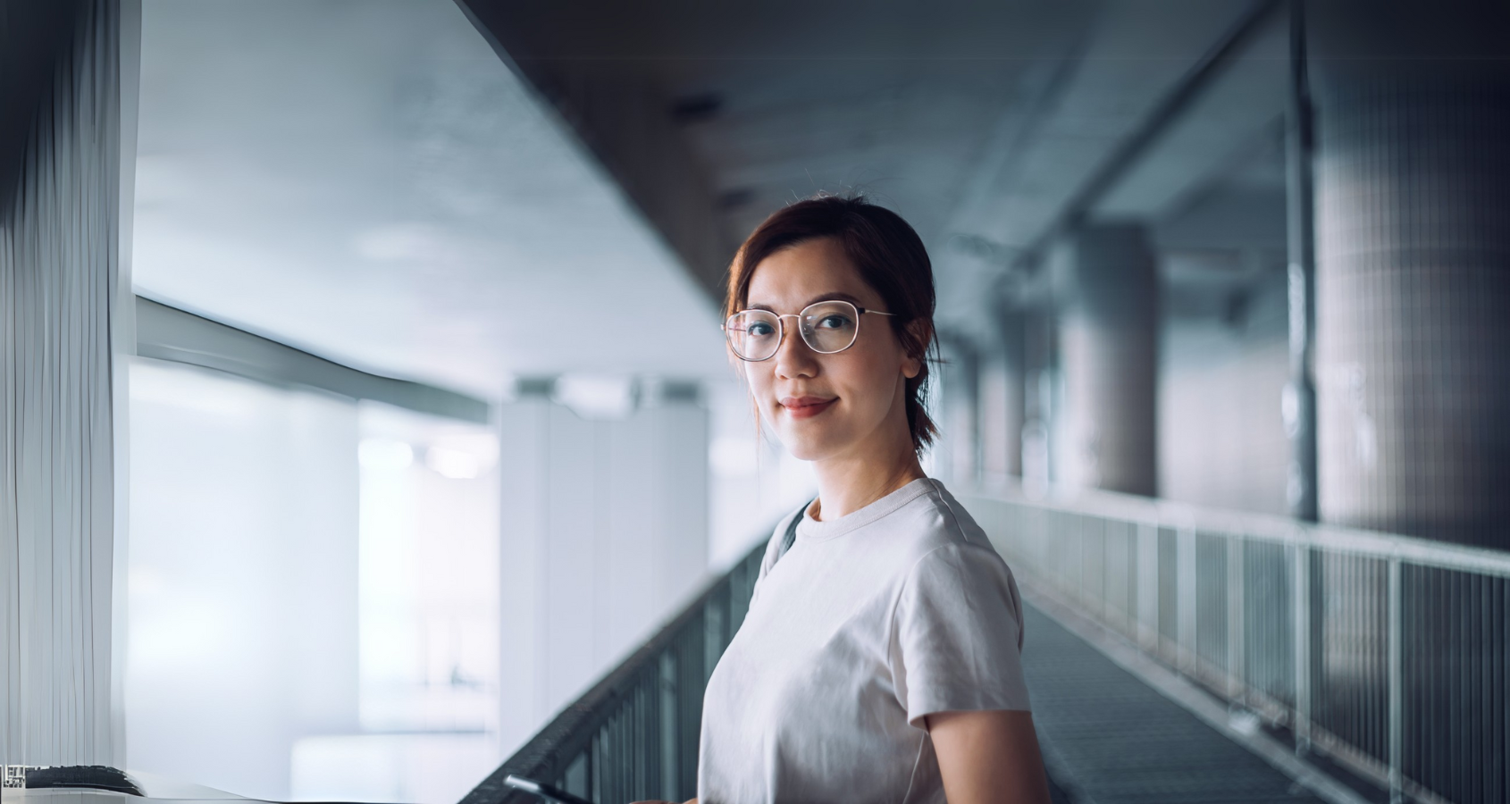 a person wearing glasses and a white shirt