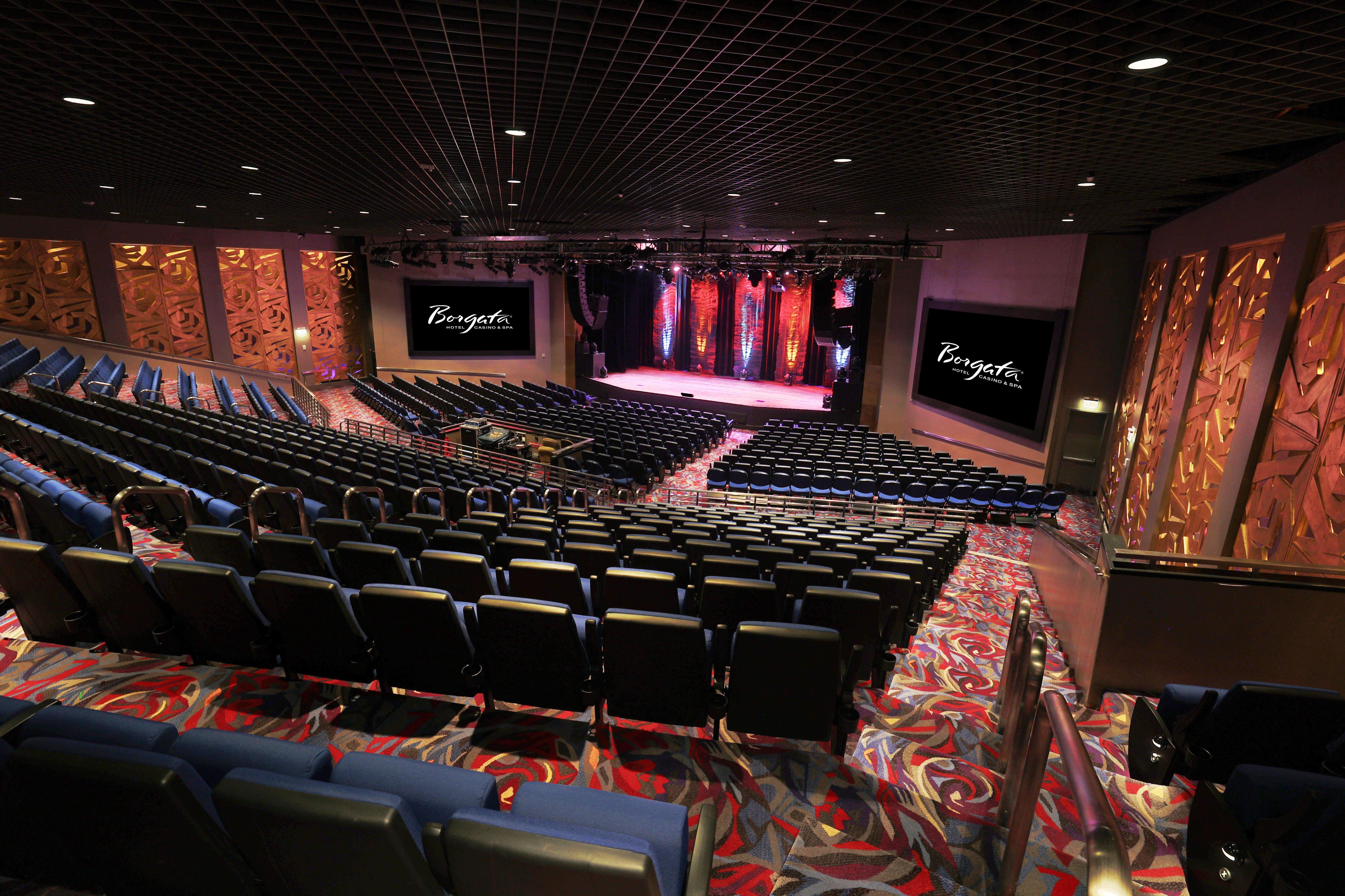 a theater with a stage and chairs