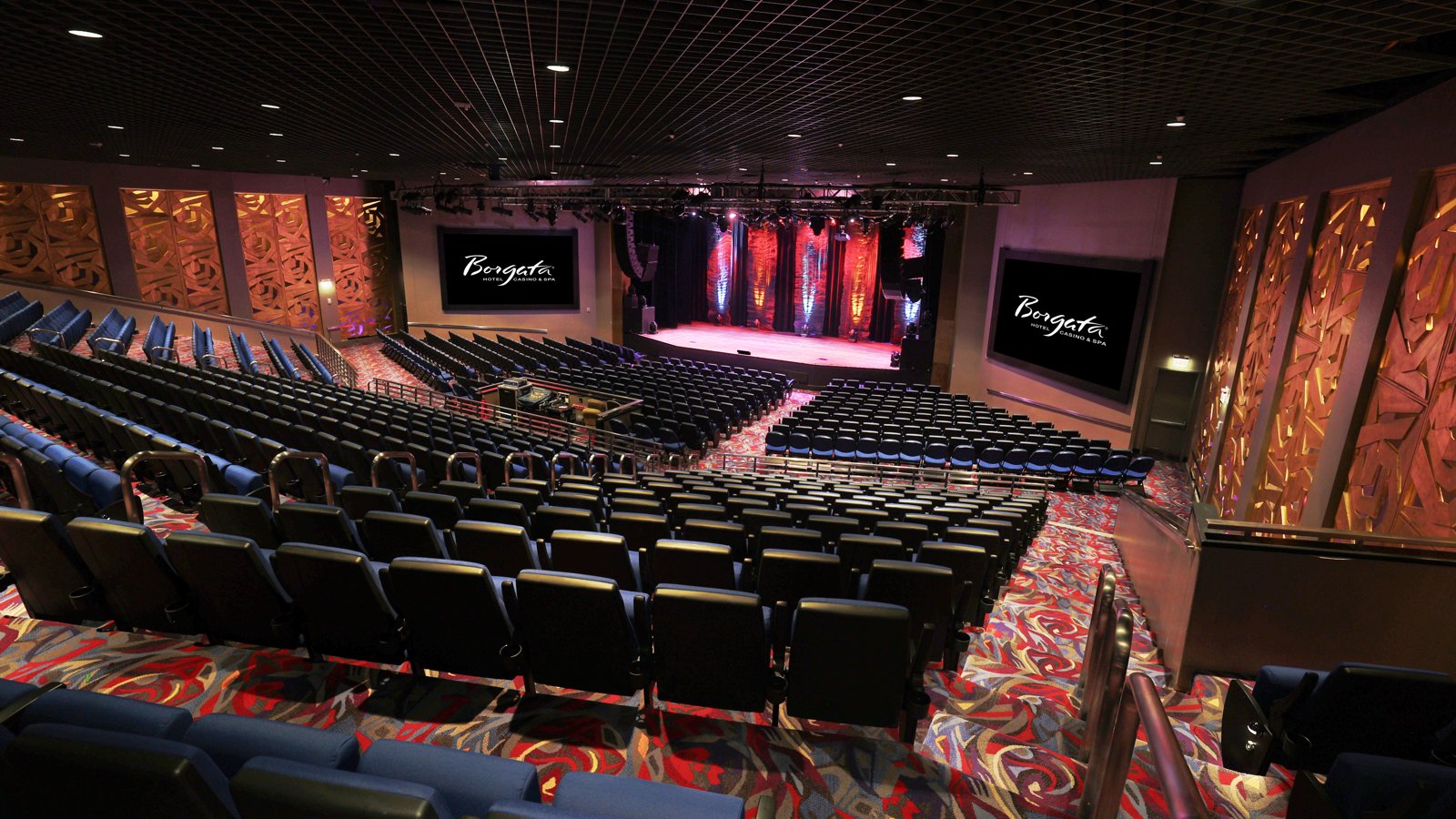 a theater with a stage and chairs