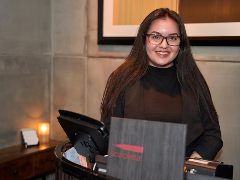 a person standing behind a counter