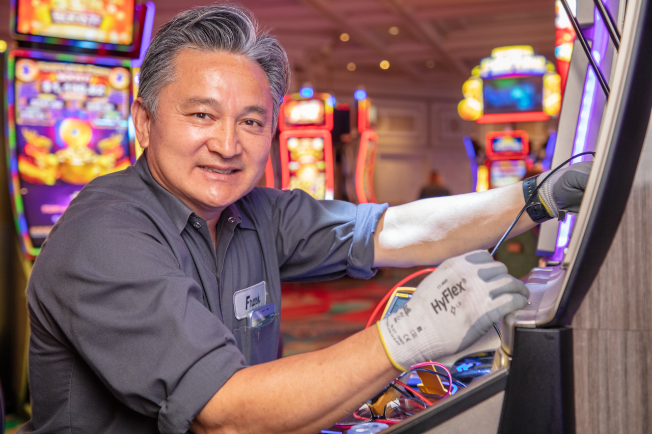 a person working at a slot machine