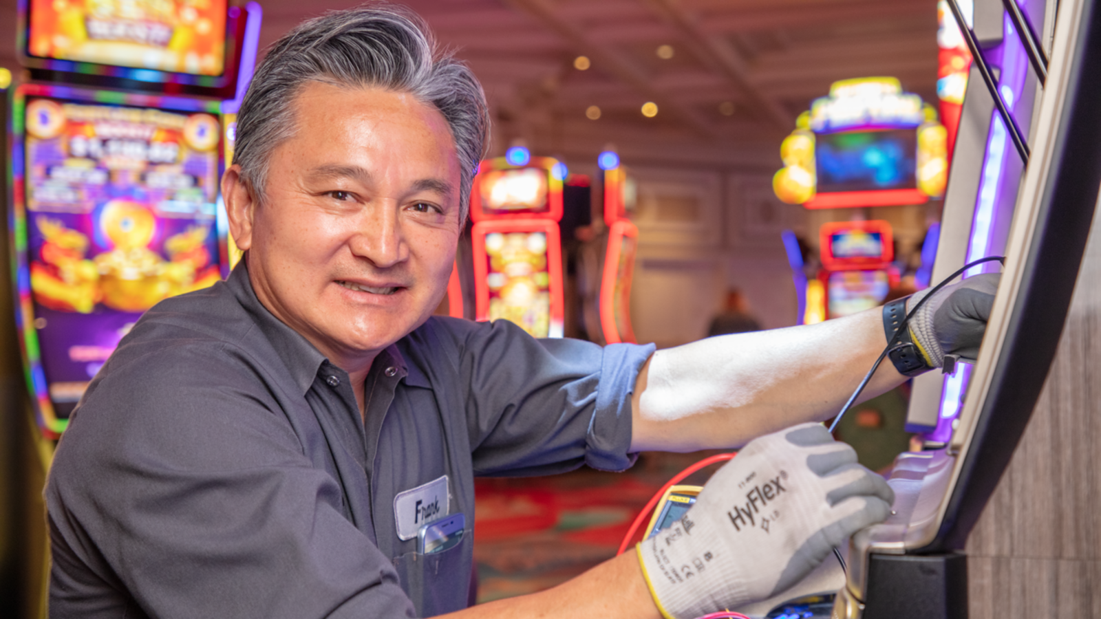 a person working at a slot machine